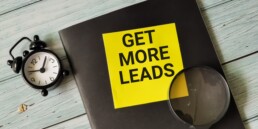 get more leads sticker on notebook