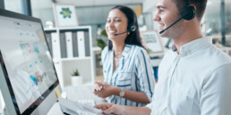 Call center, computer and team with document for customer service, crm and telemarketing in office