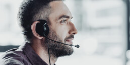call center worker in headphones with microphone