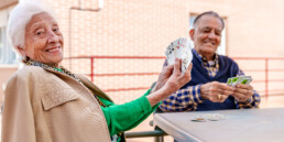 older couple playing cards