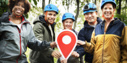 Active friends holding a check point symbol