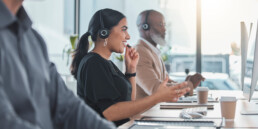 people on phone in a call center