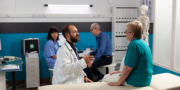 older patient talking to doctor