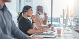 workers laughing in a call center