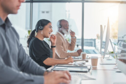 workers laughing in a call center