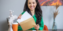 woman opening mail