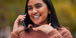 woman on phone smiling