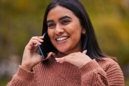 woman on phone smiling