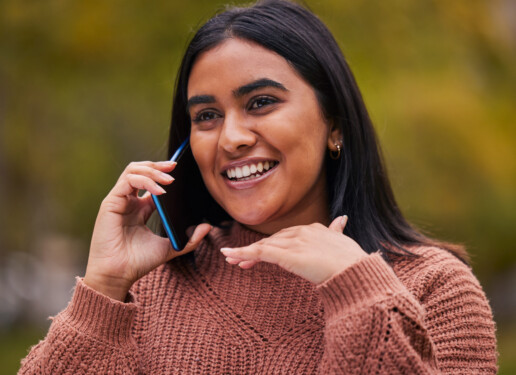 woman on phone smiling